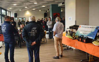 A large group photo of the participants at the Concours Fish Protect tournament