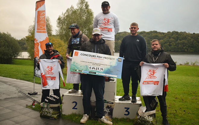 The winners of a LiTime-sponsored fishing competition pose on a podium with their prize check and branded t-shirts