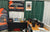 official LiTime booth at the JDM Show, featuring promotional banners and a wide display of LiFePO4 batteries