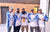 A team of five anglers posing together for a group photo in their matching blue and white Li Time fishing jerseys