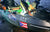 A fishing kayak rigged for night fishing, lit with green and white LEDs and decorated with Li Time and Puerto Rican flag stickers