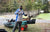 YouTuber Bearded Dad Fishing in his Li Time jersey, posing with his fully rigged fishing kayak by a boat launch