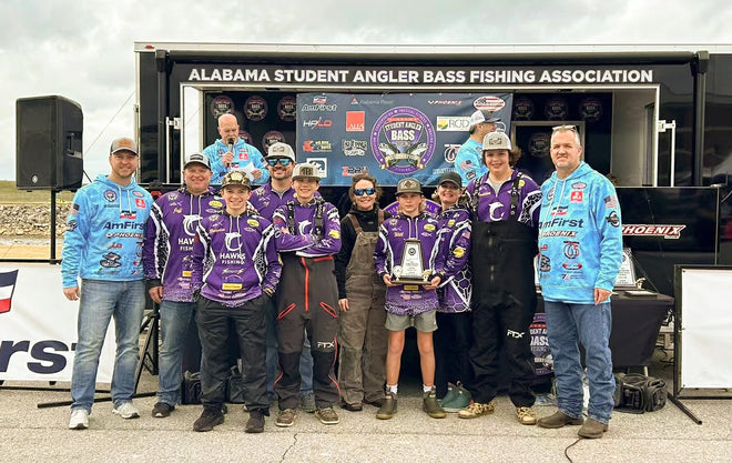 The "Hawks Fishing" team and their coaches pose with a large trophy at an Alabama Student Angler Bass Fishing event