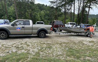 An angler prepares his truck and Li Time-powered bass boat at the Electric Bass Anglers event 