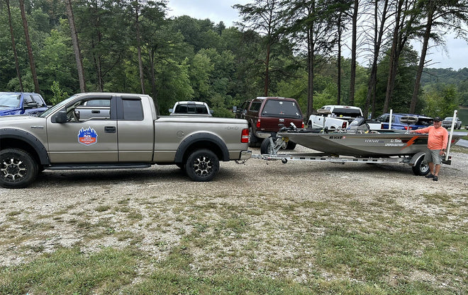 An angler prepares his truck and Li Time-powered bass boat at the Electric Bass Anglers event 