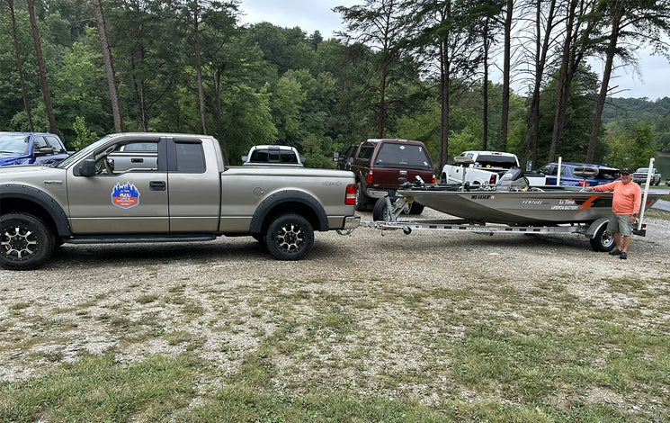 An angler prepares his truck and Li Time-powered bass boat at the Electric Bass Anglers event 