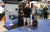 a LiTime staff member explains the 12V trolling motor system to two interested attendees at the ICAST show