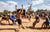 Attendees compete in the tug-of-war game in a sandy lot during the Moonlanding RV event