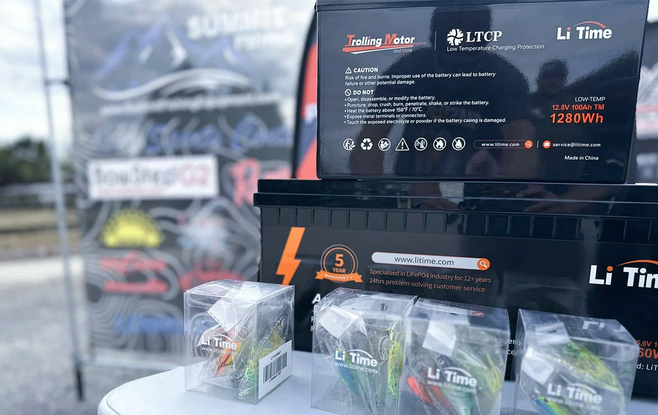 A display of LiTime products at the LEWT event, featuring low-temperature batteries and custom-branded fishing lures