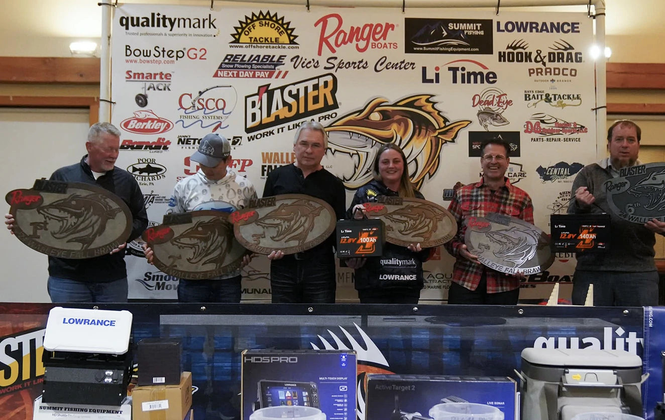 The winners of the Walleye Fall Brawl tournament pose with large, fish-shaped trophies in front of a sponsor wall featuring LiTime