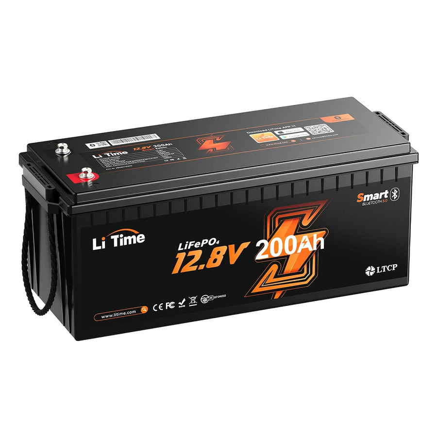 LiTime 12V 200Ah LiFePO4 battery, a long black case photographed at a three-quarter angle on white, with one red and one silver threaded terminal and a barcode label on the top face, a rope carry handle at the near end, and the front printed with the LiTime wordmark, the chemistry and capacity designation, a Bluetooth badge, a low-temperature-protection marking, the manufacturer's web address and CE, FCC and RoHS marks.