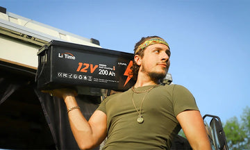 a man confidently carries a LiTime 12V 200Ah lithium rv battery, showcasing its lightweight design