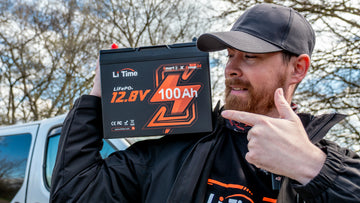 man showcasing a LiTime 12.8V 100Ah battery, highlighting its features for LiTime customer reviews