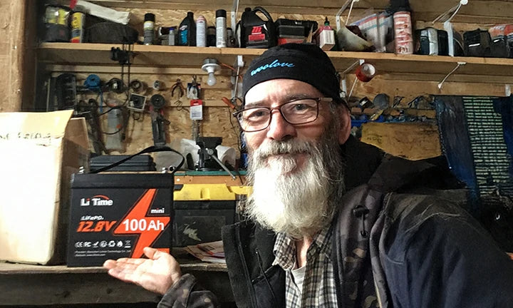 happy customer shows off their LiTime 12.8V 100Ah mini battery great power solution for workshop