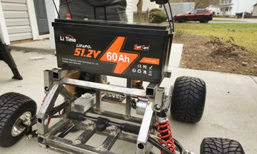 a LiTime 48V 60Ah battery is mounted on a metal frame, showcasing its installation for a litime lithium golf cart battery customer review