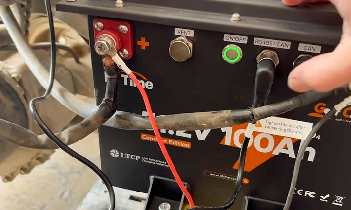 Close-up of a LiTime 48V 100Ah battery connections, highlighting the terminals and ports for a litime lithium golf cart battery customer review