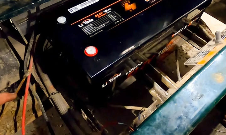 A LiTime LiFePO4 battery is installed in a golf cart, showing connections and setup for a litime lithium golf cart battery customer review